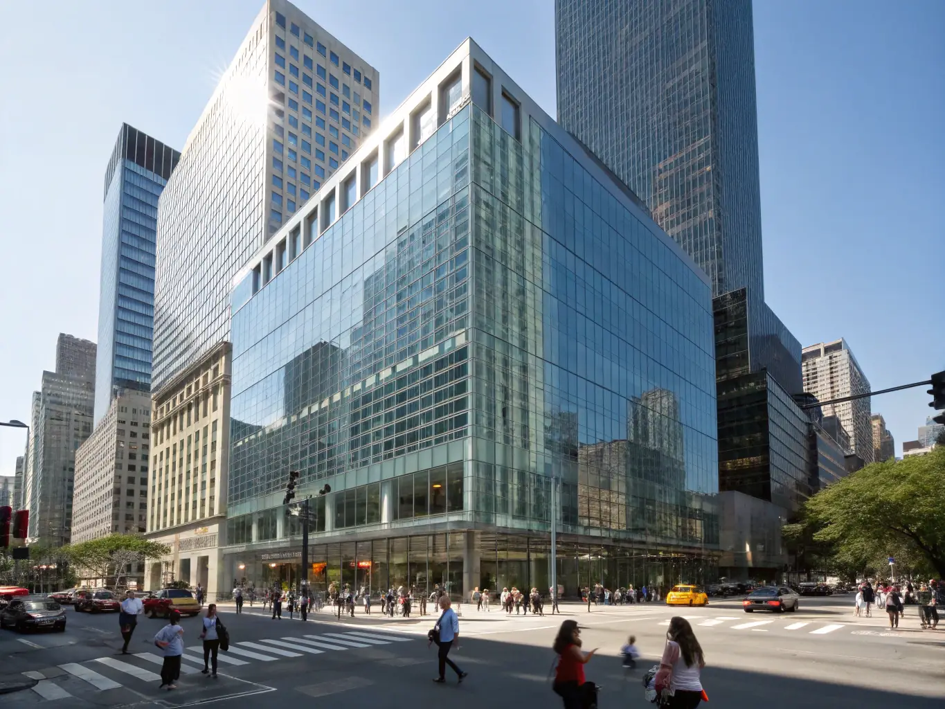 A drone shot of a modern commercial office building, highlighting its architectural design and prime location within a bustling urban environment.